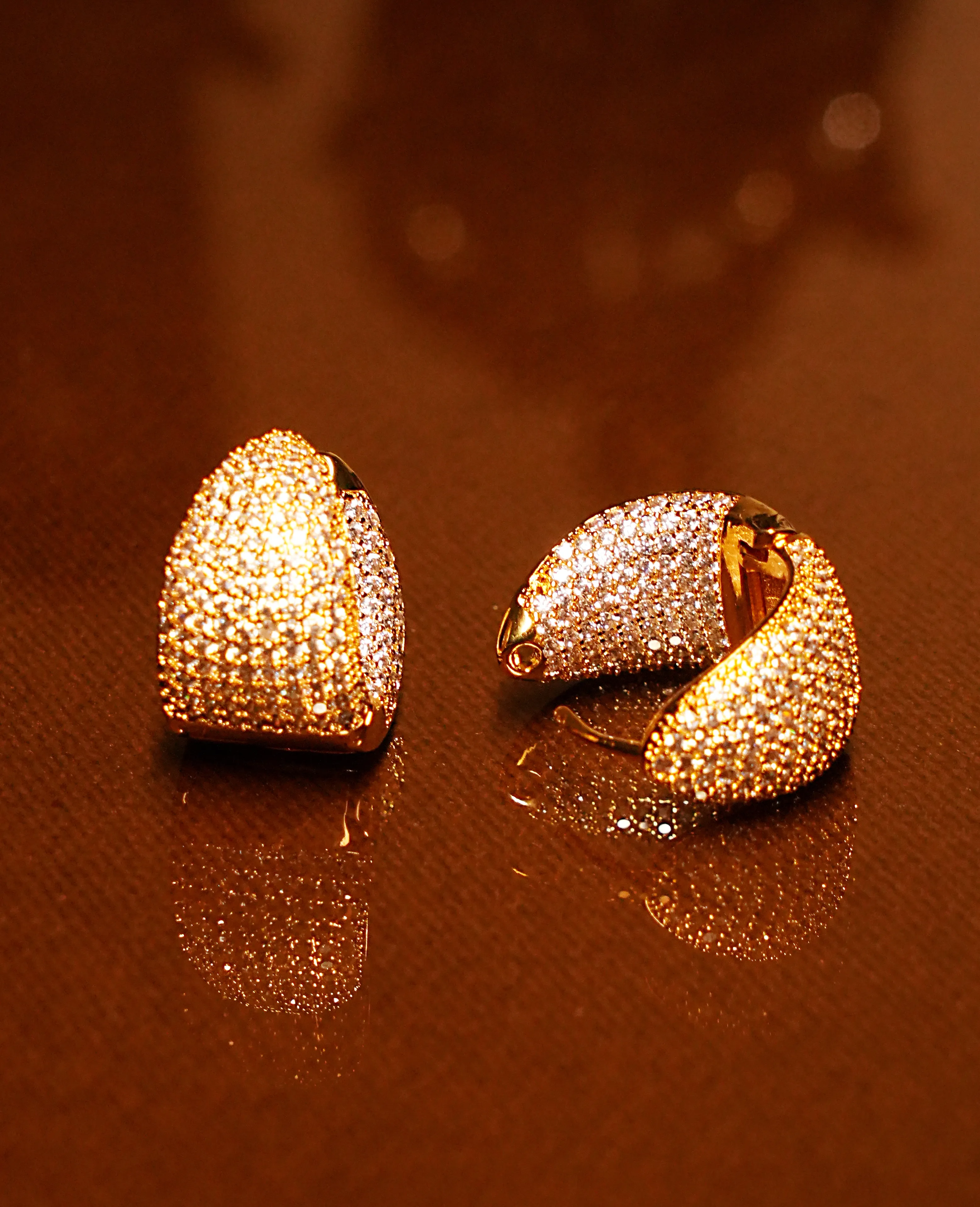 AD Golden Loop Earrings – A Sparkling Twist of Elegance and Style