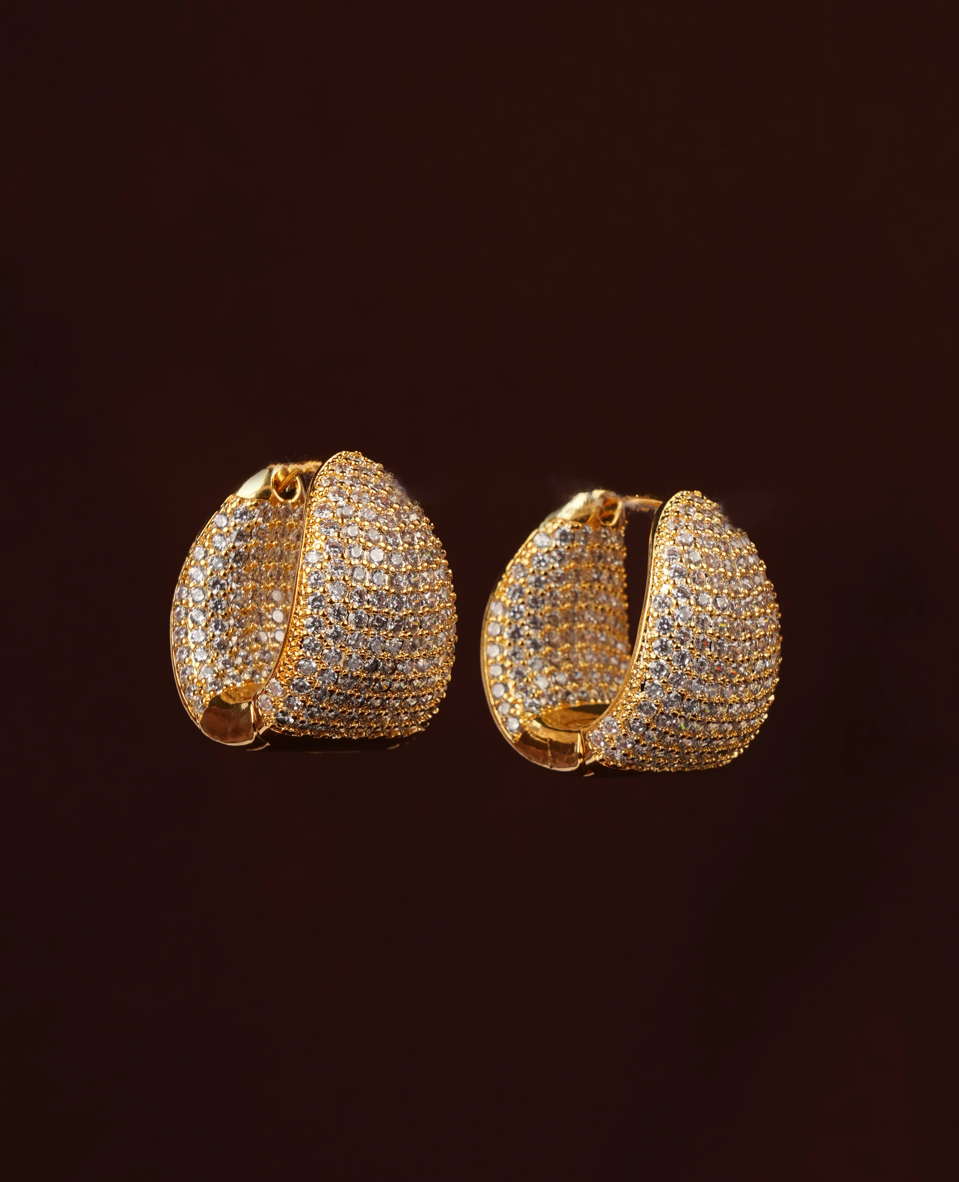AD Golden Loop Earrings – A Sparkling Twist of Elegance and Style